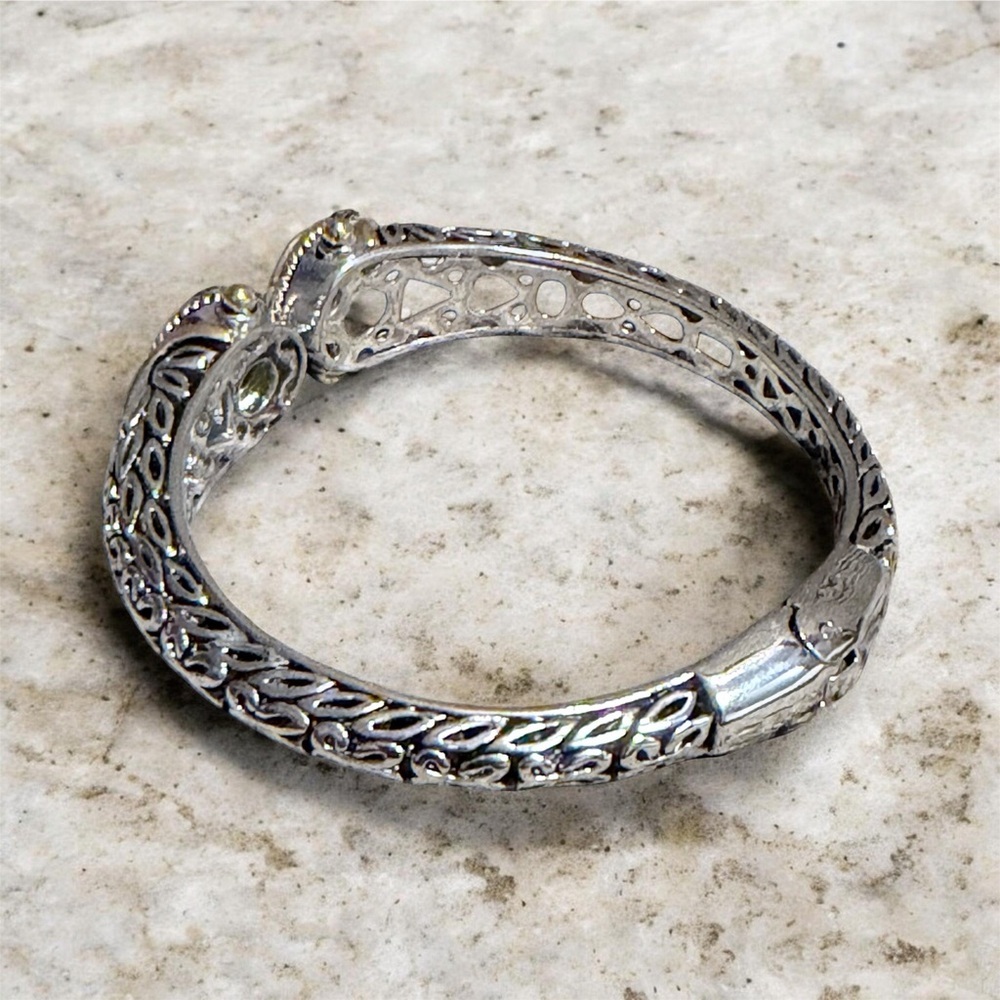 Elegant Silver and Gold Tone Bracelet Blue Accents Dec Birthstone Hinge Bangle - Picture 2 of 10